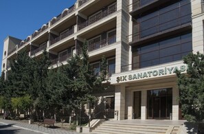 A multi-story building with a sign reading "SIX SANATORIYAS". - Shihov Hotel (Baku)
