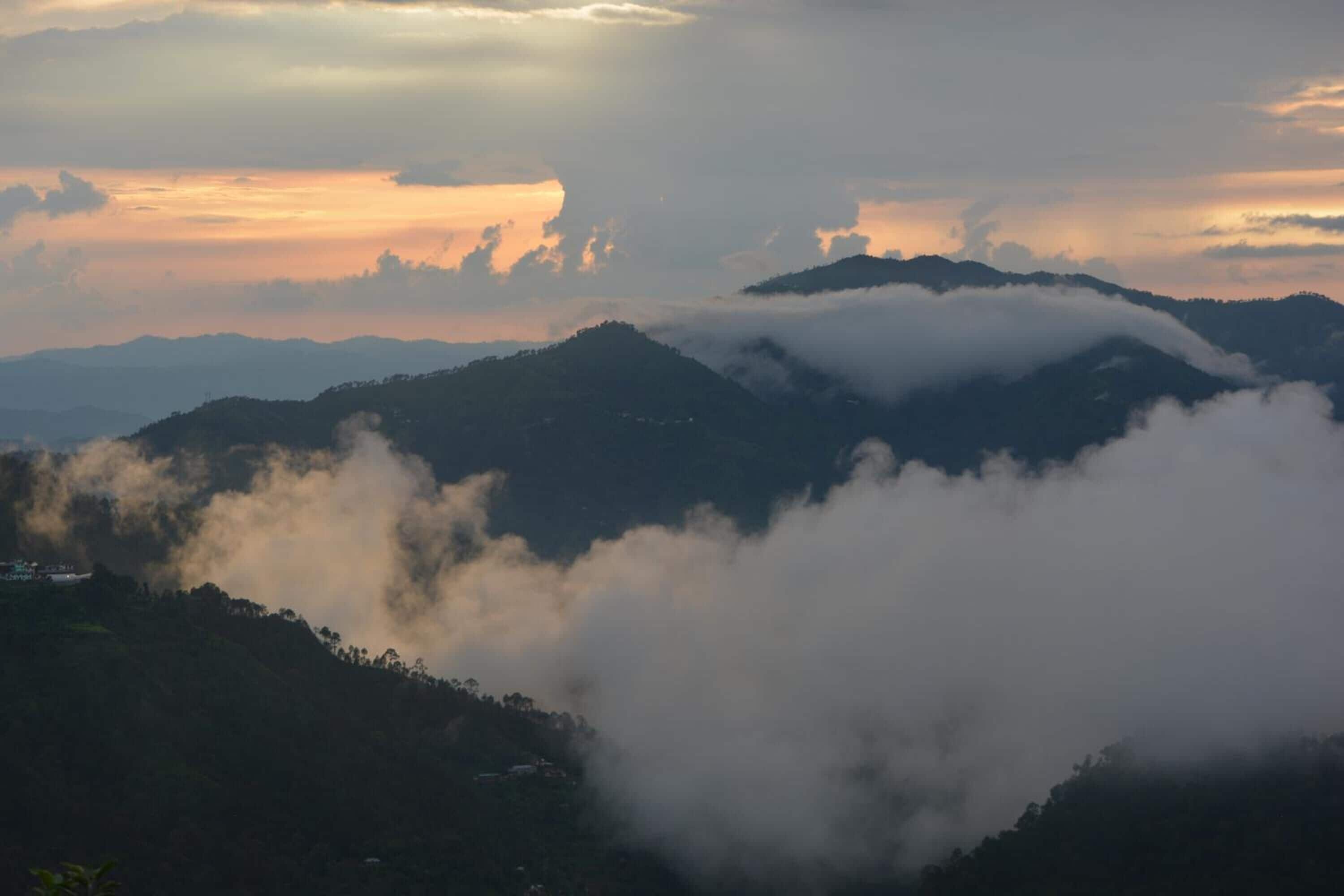 A mountainous landscape with rolling hills and a valley.