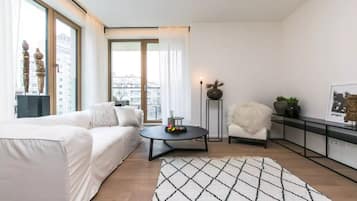 Apartamento, 1 habitación | Zona de estar | Una televisión de pantalla plana