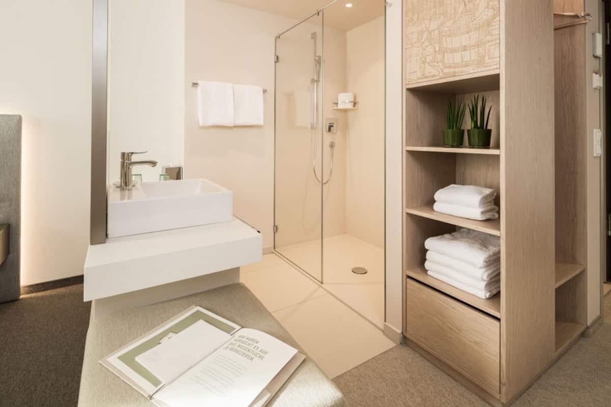 superior double room | bathroom | eco-friendly toiletries, hair dryer, bathrobes, towels