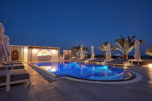 Outdoor pool, pool umbrellas, pool loungers