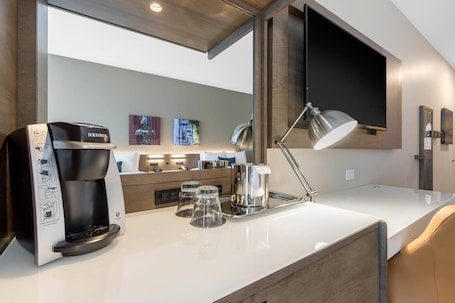 Hypo-allergenic bedding, desk, laptop workspace, iron/ironing board. Cambria Hotel Mount Pleasant – Charleston