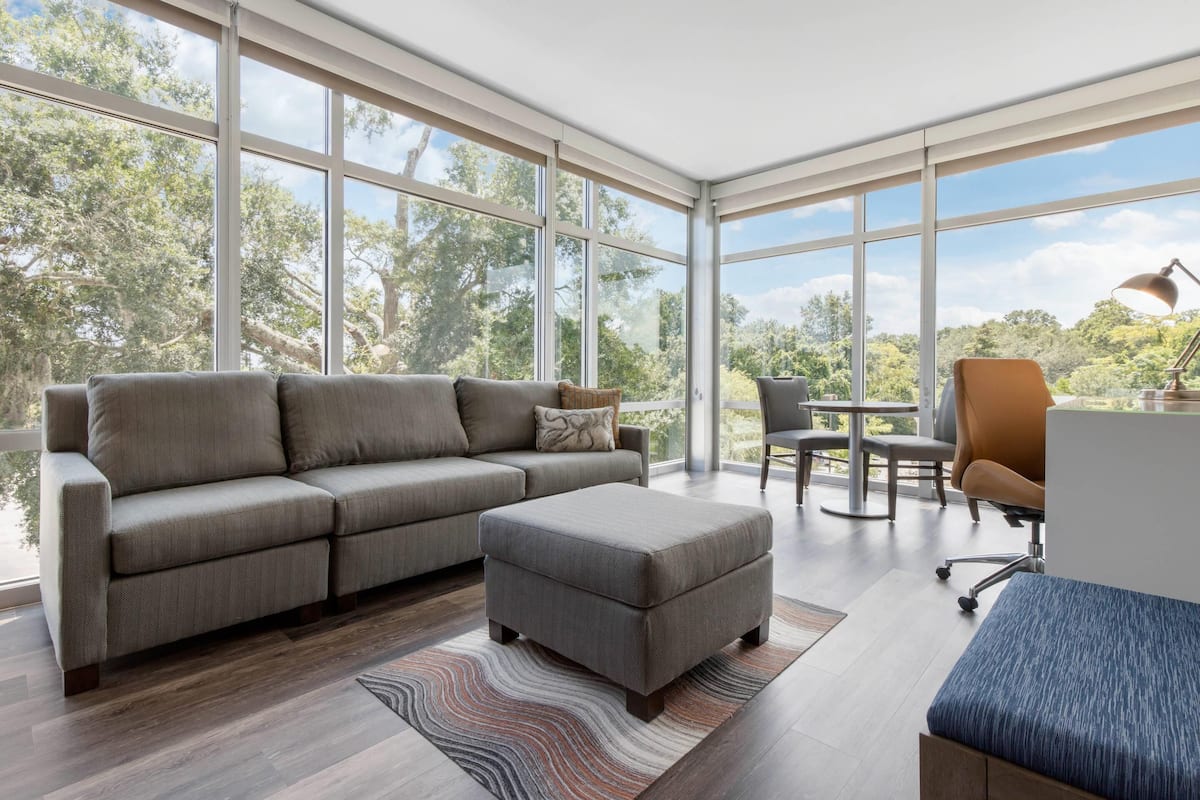 Corner King Suite with Sofa Bed | Hypo-allergenic bedding, desk, laptop workspace, iron/ironing board