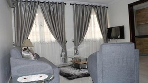 Apartment, 1 Bedroom | Living room | Flat-screen TV - Jaria Apartments (Accra)