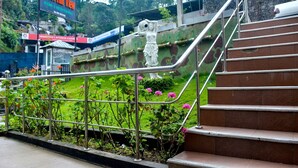 A staircase leading to a hotel with a sign reading "Hotel Hill View". - Hotel Hill View (Hatton)