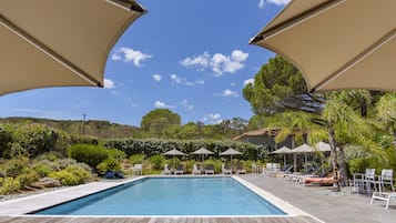 Seasonal outdoor pool, open 9:00 AM to 8:00 PM, pool umbrellas