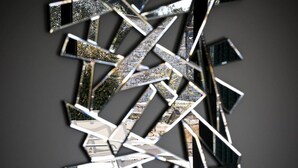 A complex geometric structure with reflective surfaces. - L'Albitru (Bonifacio)