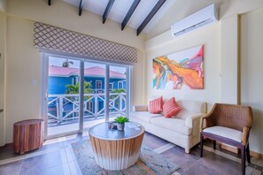 Condo, 1 Bedroom, Oceanfront | Living area | 32-inch TV with cable channels