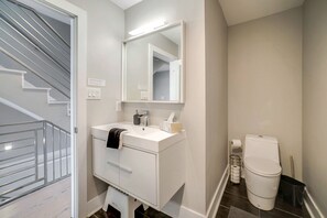 Combined shower/tub, hair dryer, towels, soap