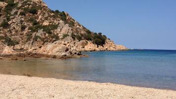 On the beach, sun-loungers, beach towels
