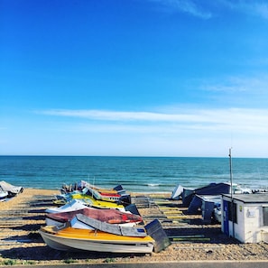 A beach with several boats parked on the shore.