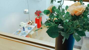 A vase with a plant on a table.