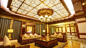 A luxurious lobby with ornate chandeliers, plush seating, and a large painting on the wall. - ChengDu Trika Tsang International Hotel (Chengdu)