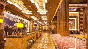 A luxurious lobby with marble floors, ornate chandeliers, and a grand reception desk. - ChengDu Trika Tsang International Hotel (Chengdu)