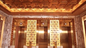An interior with three elevators, marble flooring, and ornate ceiling design. - ChengDu Trika Tsang International Hotel (Chengdu)