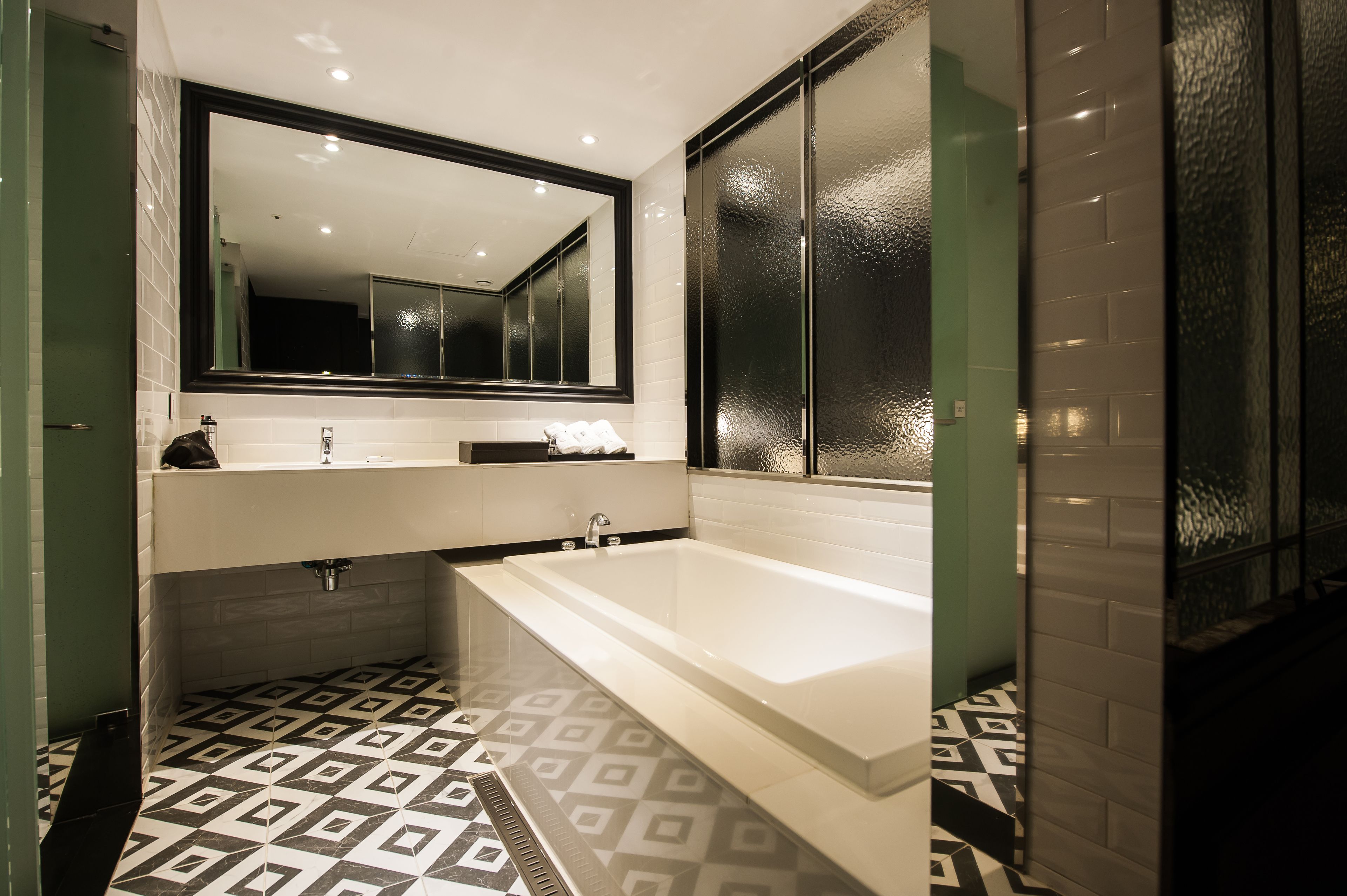 deluxe room | bathroom | separate bathtub and shower, deep-soaking bathtub, hair dryer, bathrobes