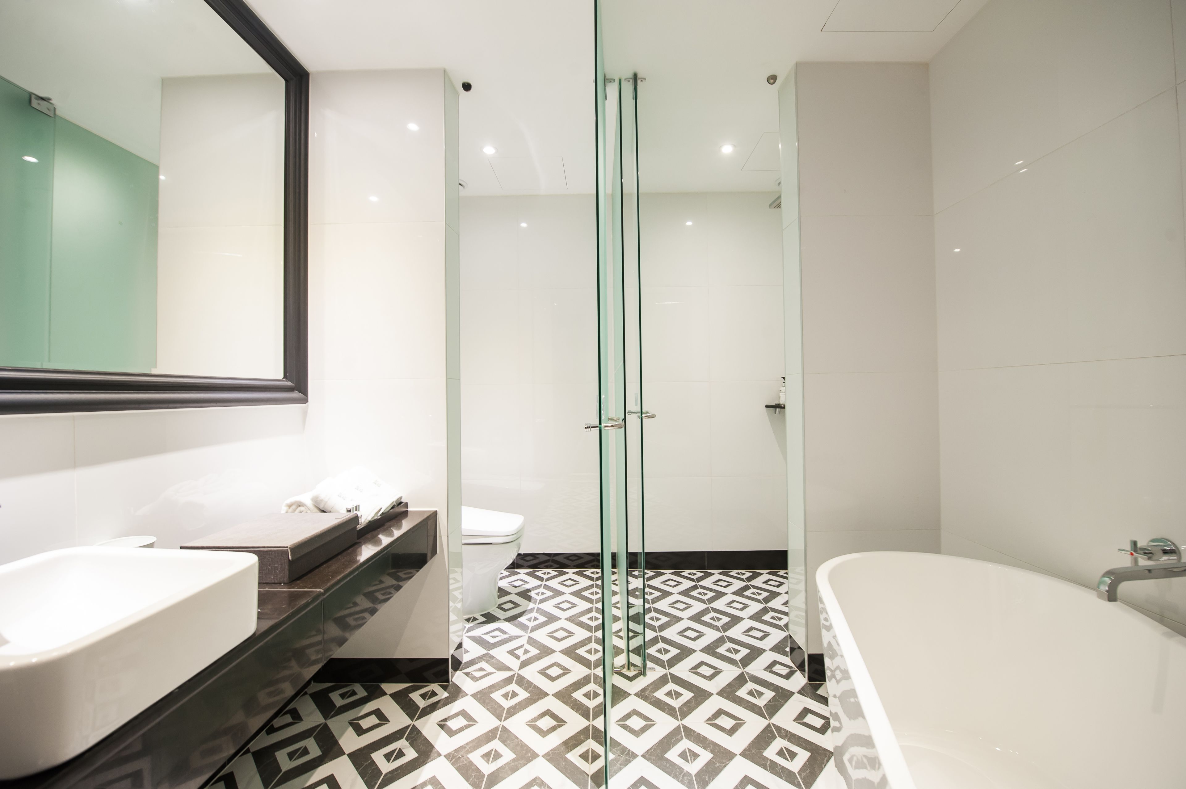 deluxe room | bathroom | separate bathtub and shower, deep-soaking bathtub, hair dryer, bathrobes
