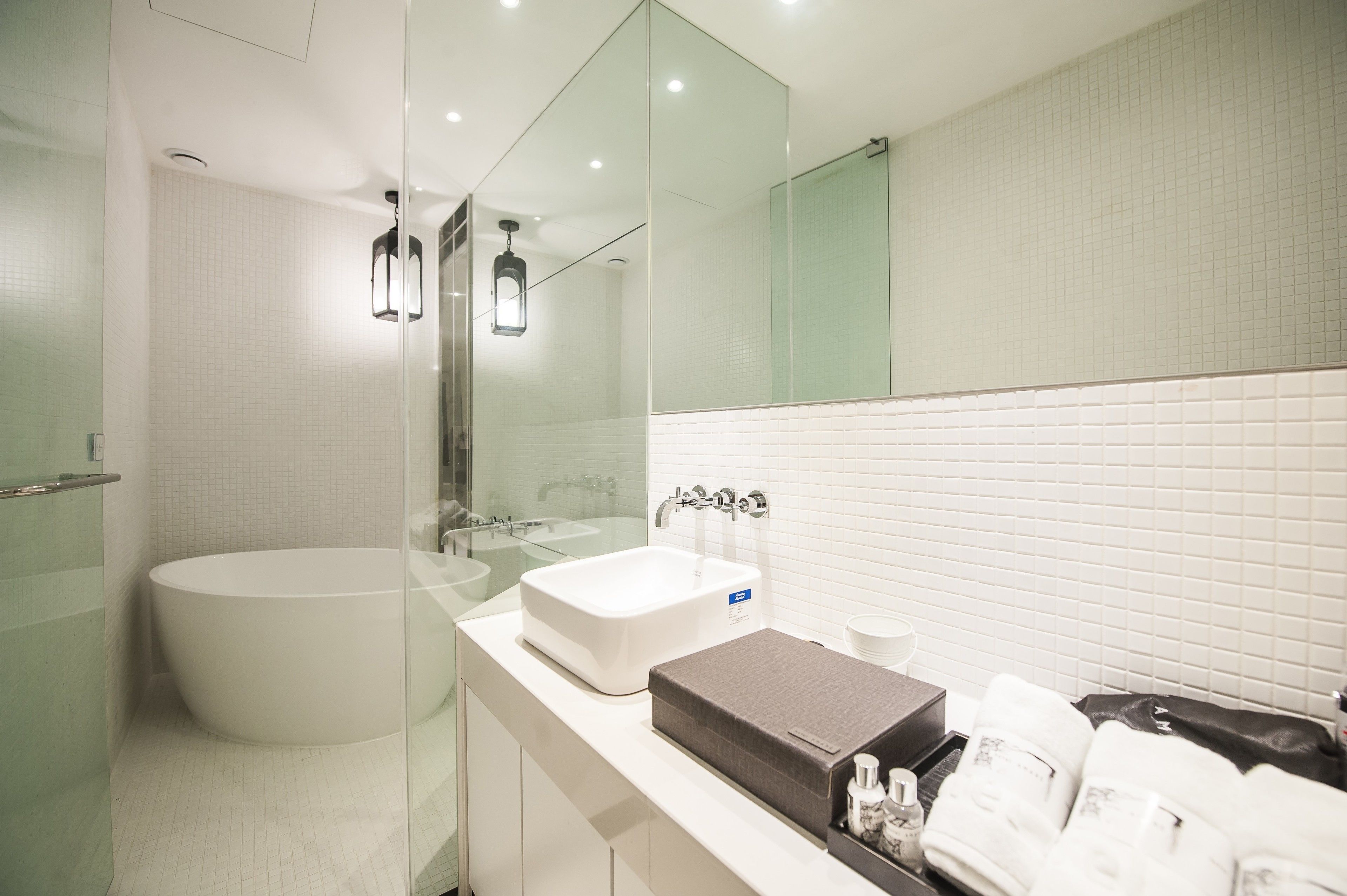 deluxe room | bathroom | separate bathtub and shower, deep-soaking bathtub, hair dryer, bathrobes