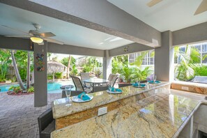 Outdoor dining - Coral Escape: 6-Bedroom Anna Maria Island Home with Pool and Spa! 1 Block to Bea (Holmes Beach)