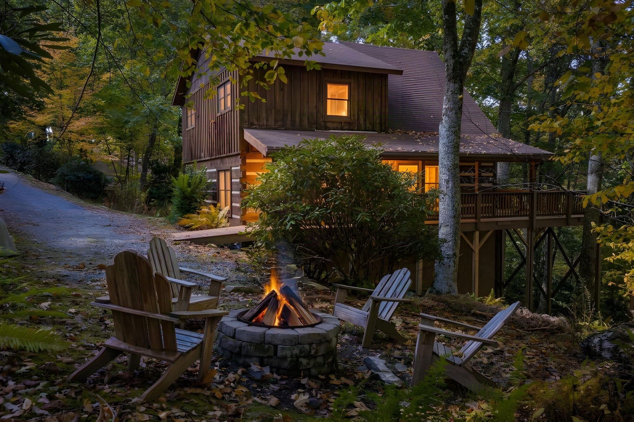 A cabin with a fire pit and outdoor seating.