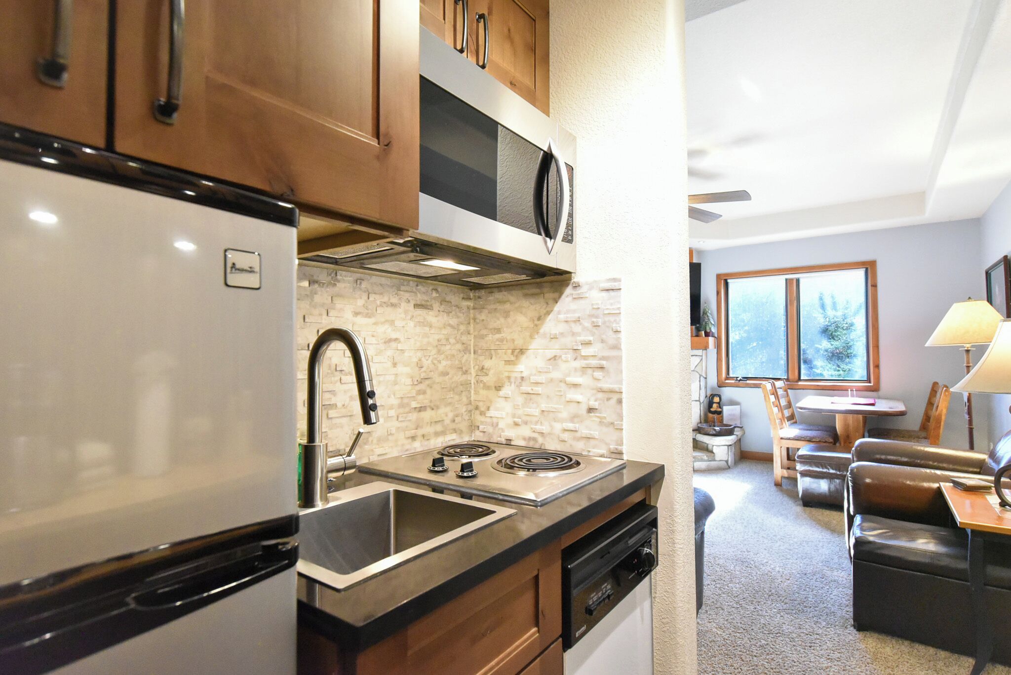 Fridge, stovetop, dishwasher, coffee/tea maker