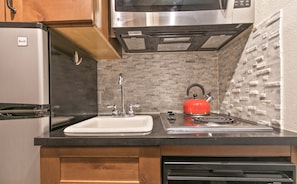 Fridge, stovetop, dishwasher, coffee/tea maker