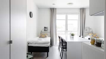 Family Studio | Laptop workspace, blackout drapes, soundproofing, iron/ironing board