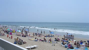 On the beach, sun-loungers