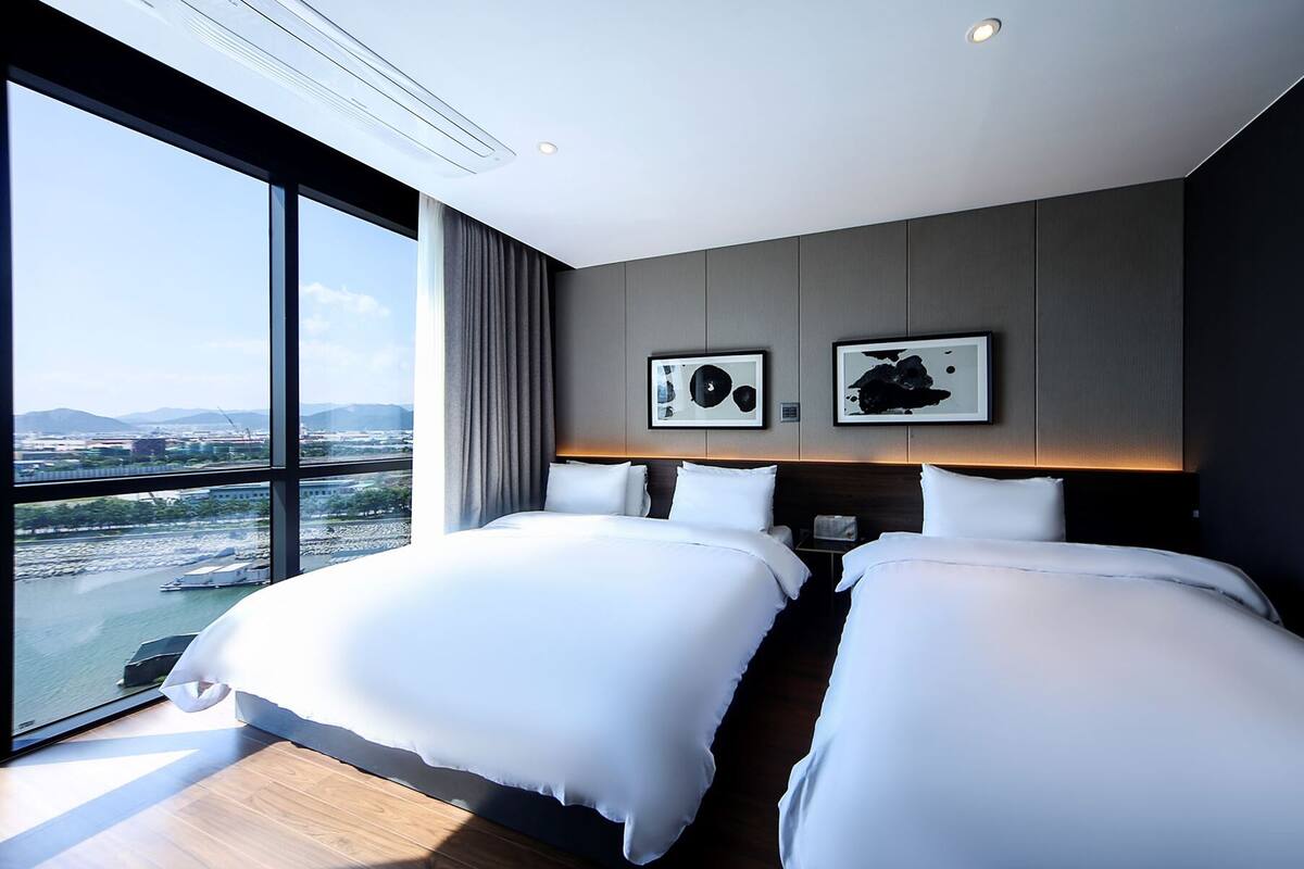 Family Twin Room, 1 Bedroom, Private Bathroom, Beachfront | Down comforters, soundproofing, WiFi (free), bed sheets