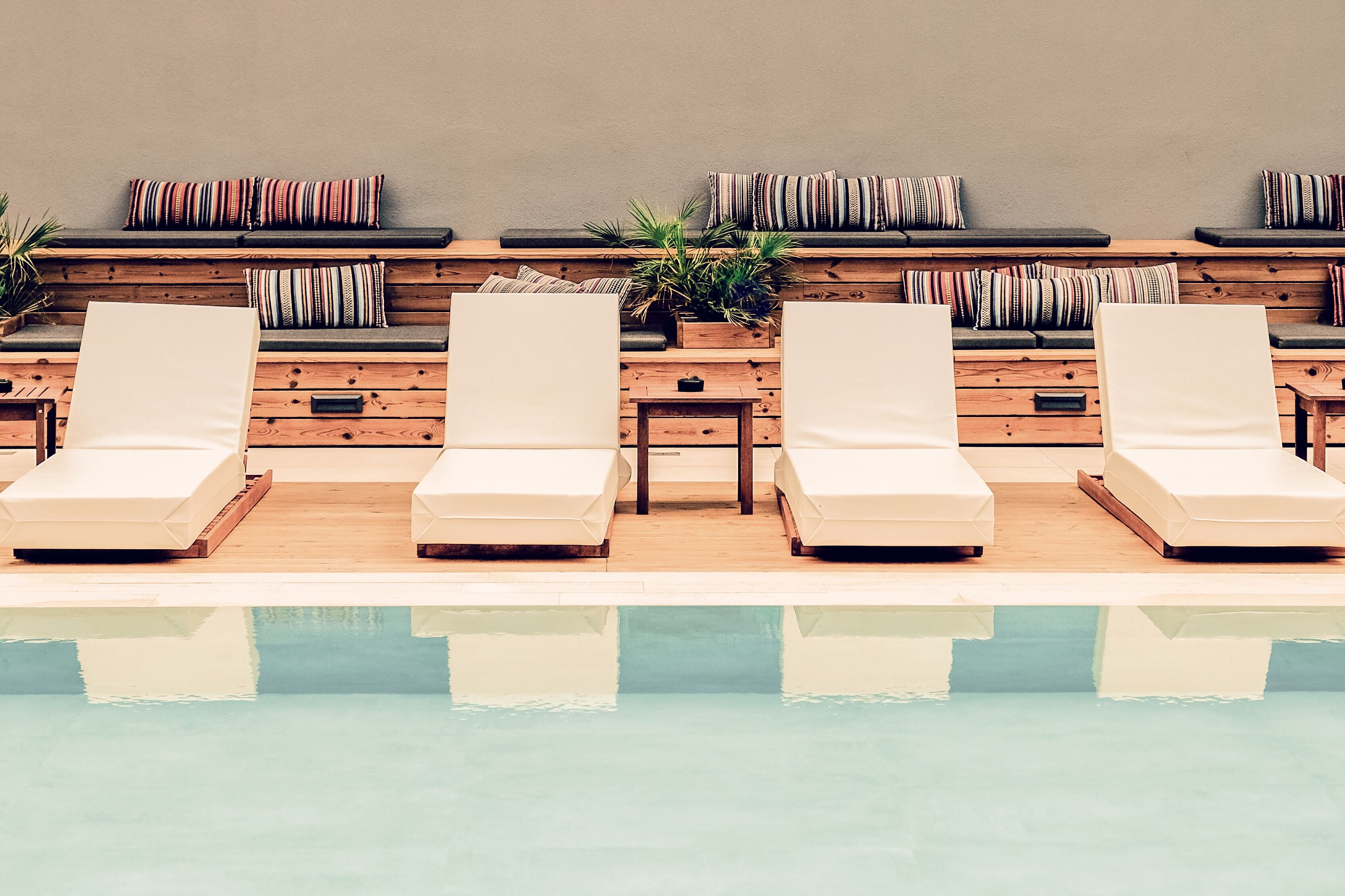 indoor pool, outdoor pool, pool umbrellas, pool loungers