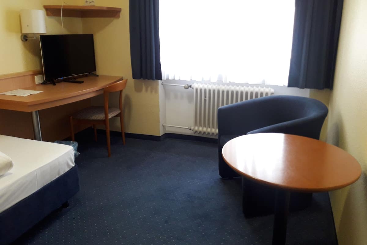 Standaard eenpersoonskamer | Luxe beddengoed, een bureau, gratis wifi, beddengoed