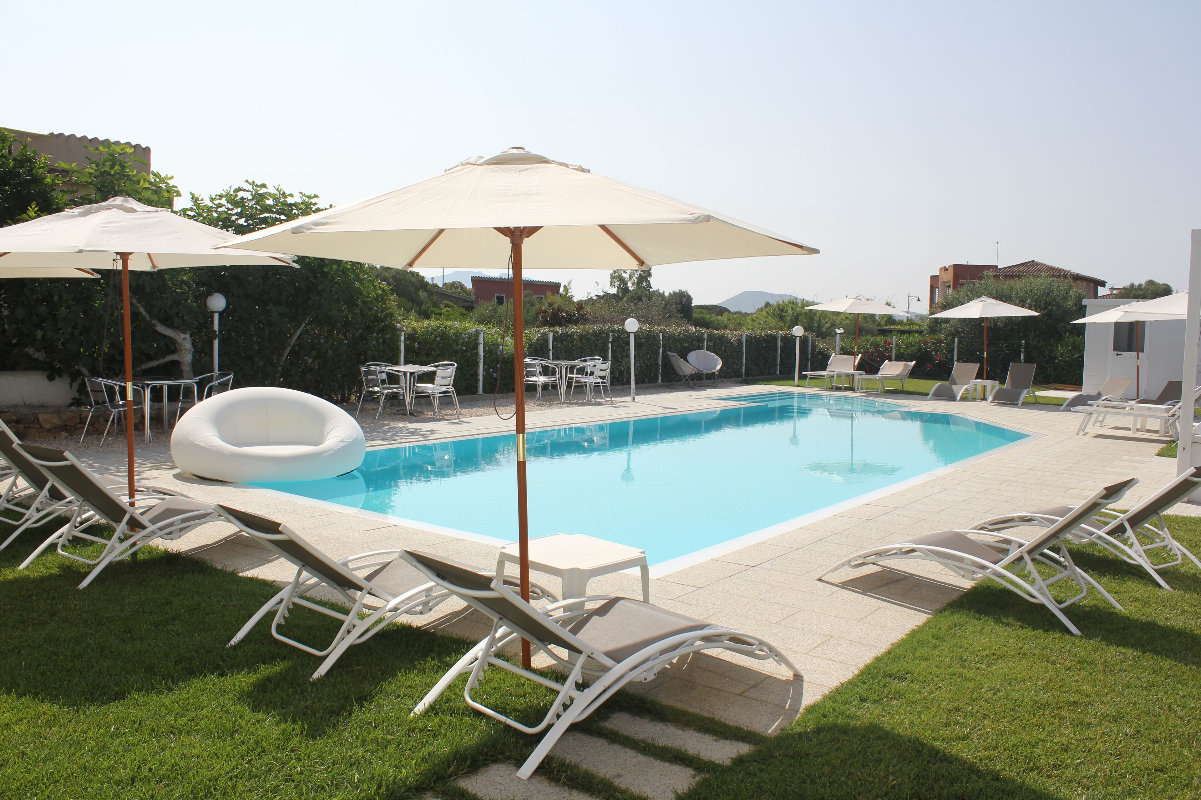 Seasonal outdoor pool, open 9:00 AM to 8:00 PM, pool loungers