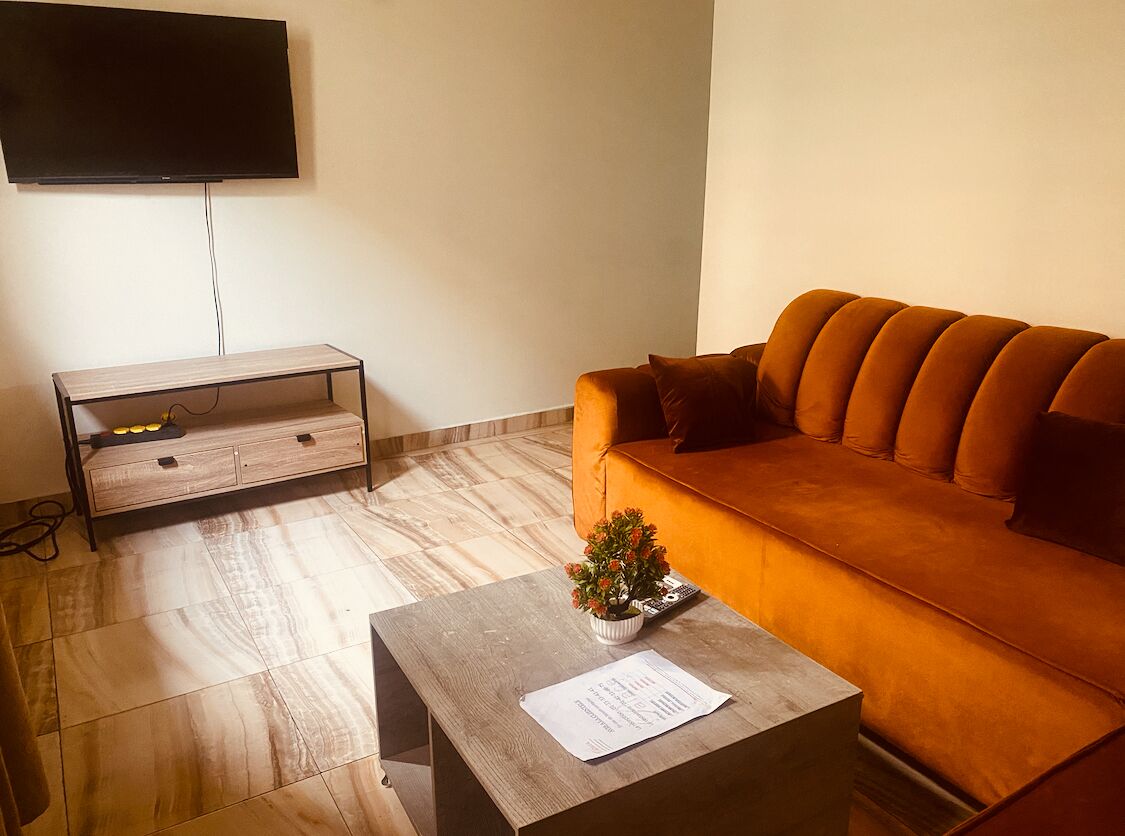 Apartment, 1 Bedroom | Living area | 32-inch flat-screen TV with cable channels, TV