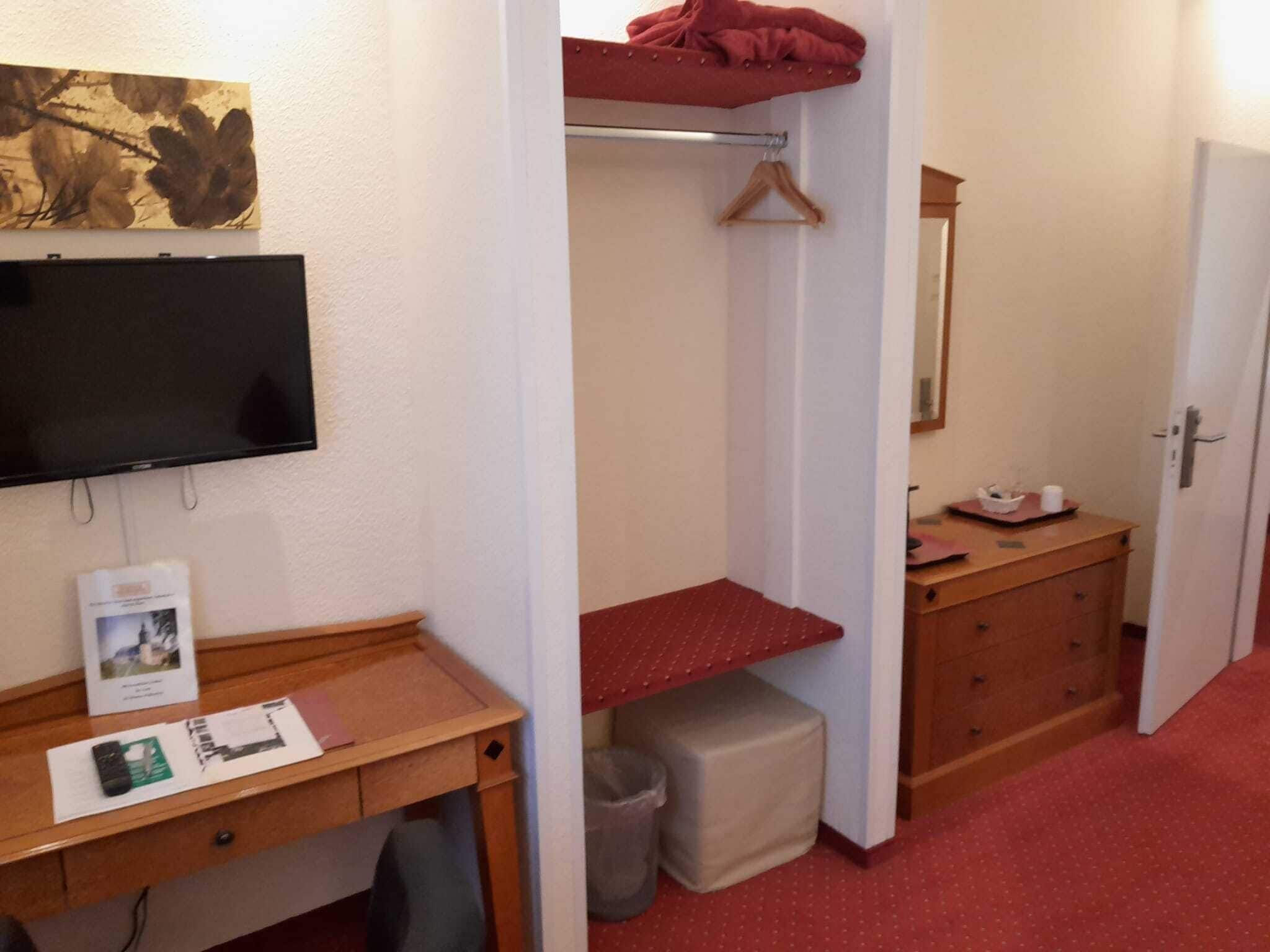 standard single room | living area | 22-inch flat-screen tv with satellite channels, tv