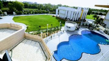 Outdoor pool, open 7:00 AM to 7:00 PM, free pool cabanas, pool umbrellas