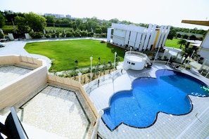 Outdoor pool, open 7:00 AM to 7:00 PM, free pool cabanas, pool umbrellas