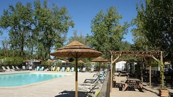 Seasonal outdoor pool, open 10:00 AM to 7:00 PM, pool umbrellas