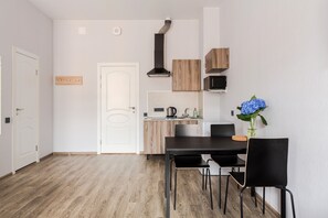 Enjoy meals and gatherings in this well-designed space with a dining area, kitchenette, and separate access to another room.