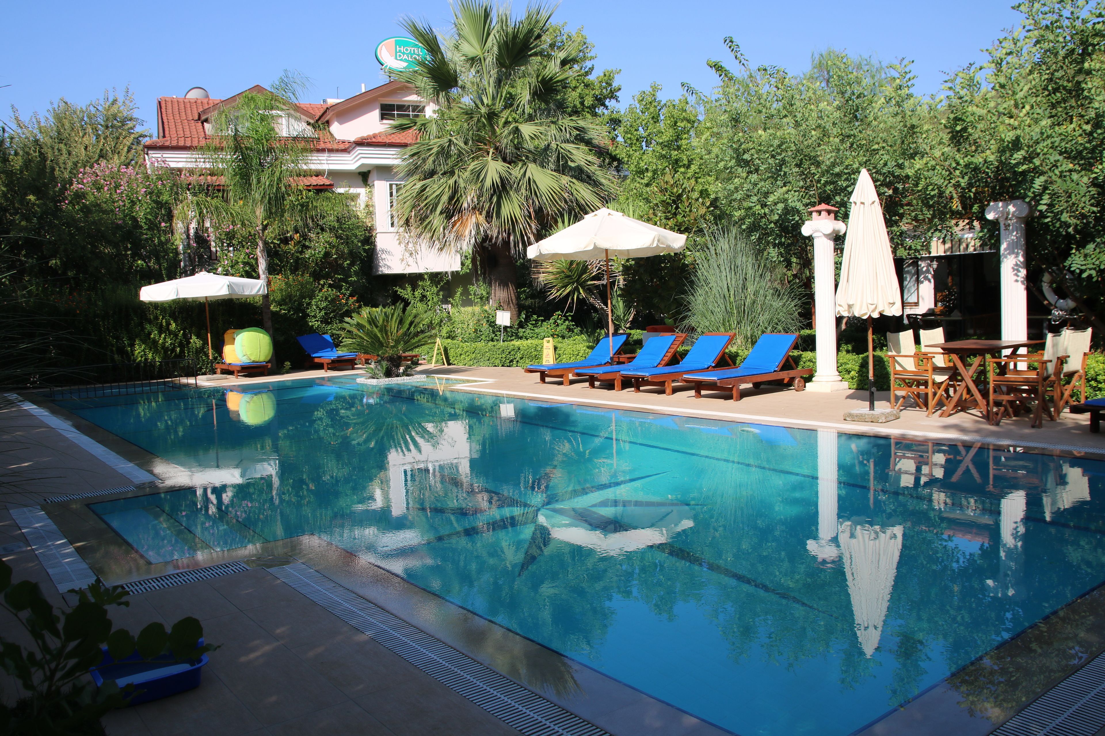 seasonal outdoor pool, pool umbrellas, pool loungers