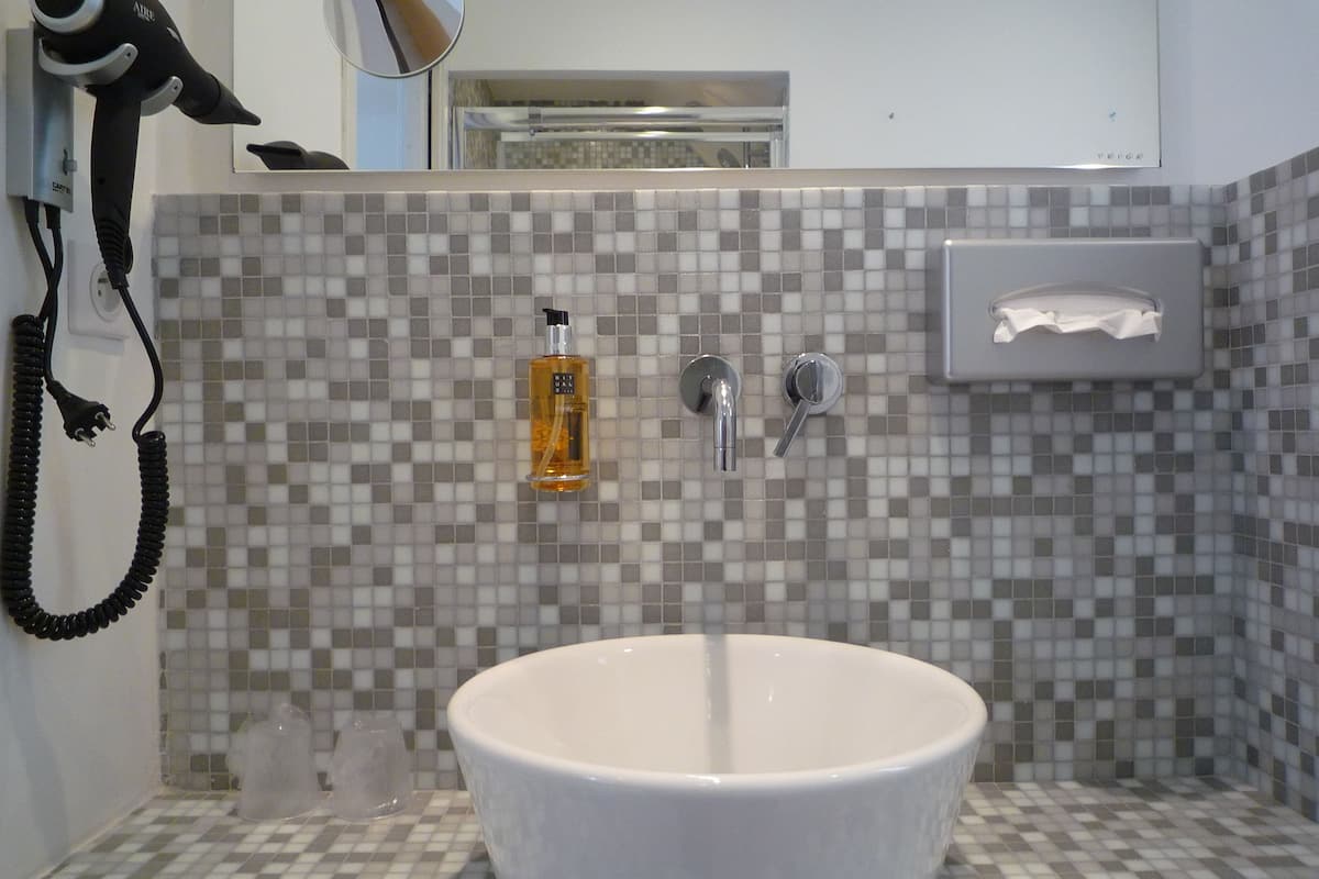 comfort room (bed accessible only via staircase) | bathroom | eco-friendly toiletries, hair dryer, towels, soap