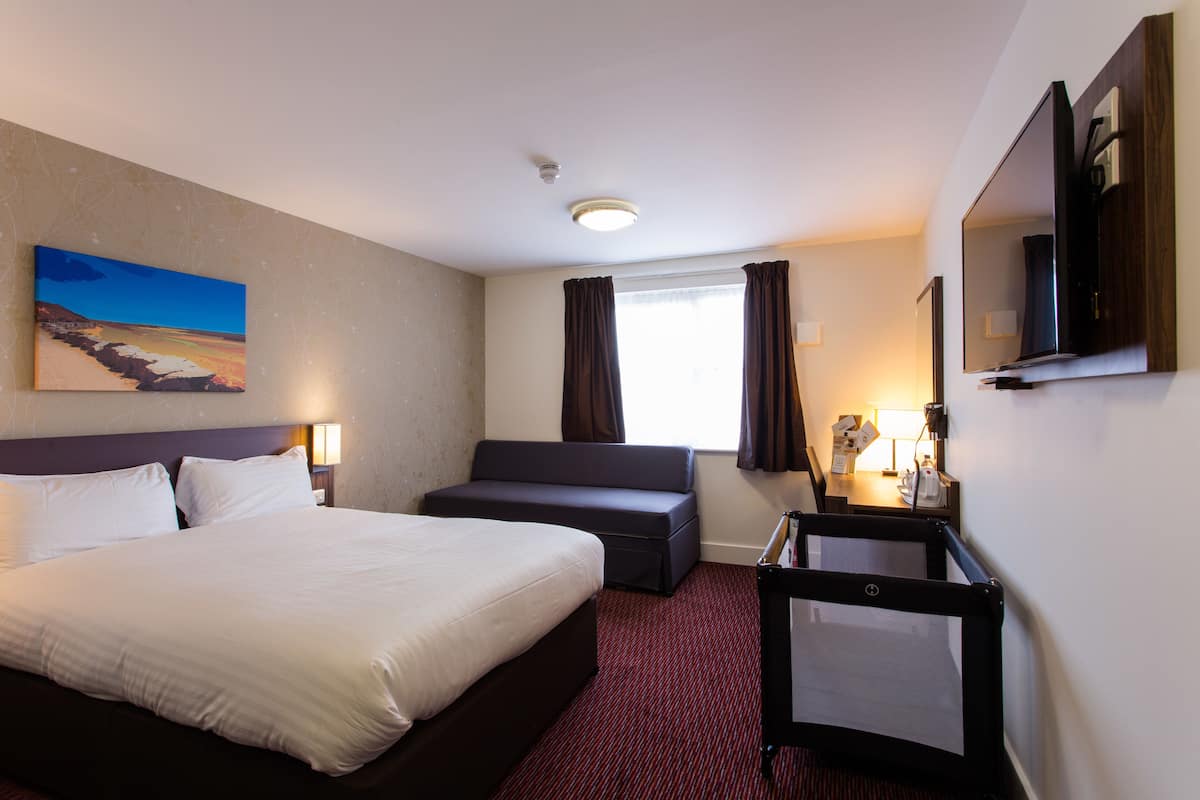 family room | desk, soundproofing, iron/ironing board, free cots/infant beds