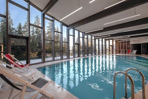 Indoor pool, open 9:00 AM to 8:00 PM, pool loungers