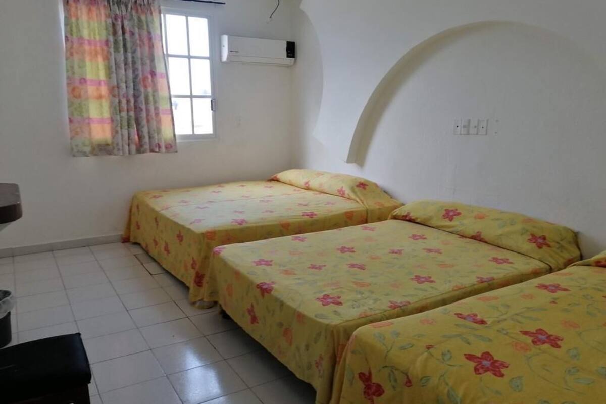 Triple Room, Multiple Beds | Iron/ironing board, free WiFi, bed sheets