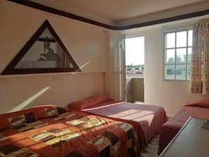 Triple Room, Multiple Beds | Iron/ironing board, free WiFi, bed sheets