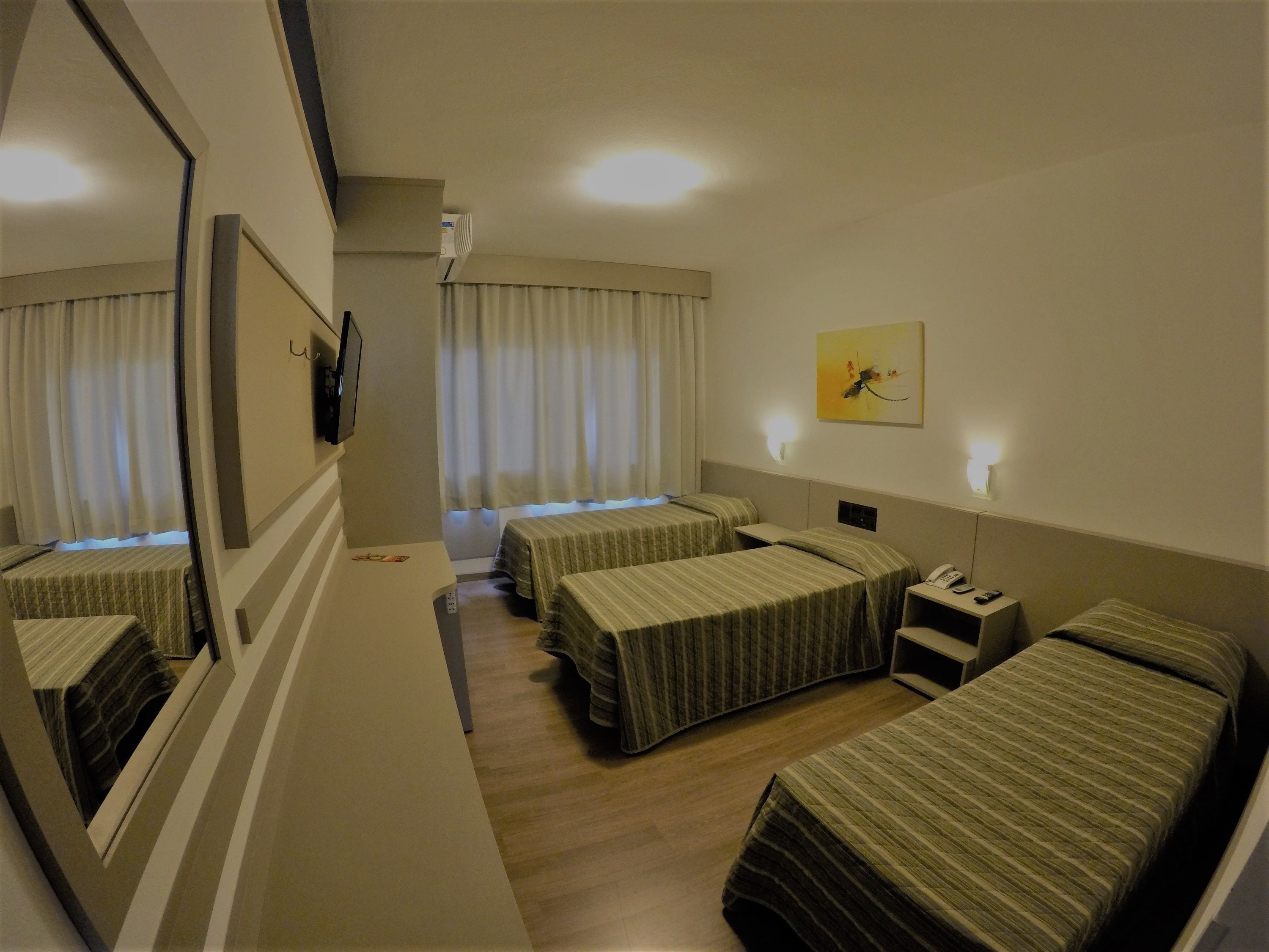 Standard Triple Room, 3 Twin Beds | Minibar, in-room safe, desk, blackout drapes