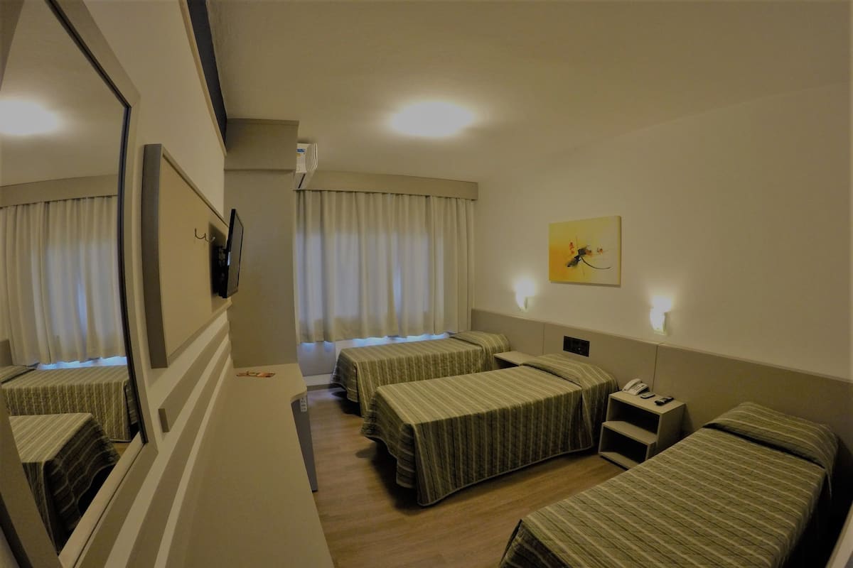 Standard Triple Room, 3 Twin Beds | Minibar, in-room safe, desk, blackout drapes