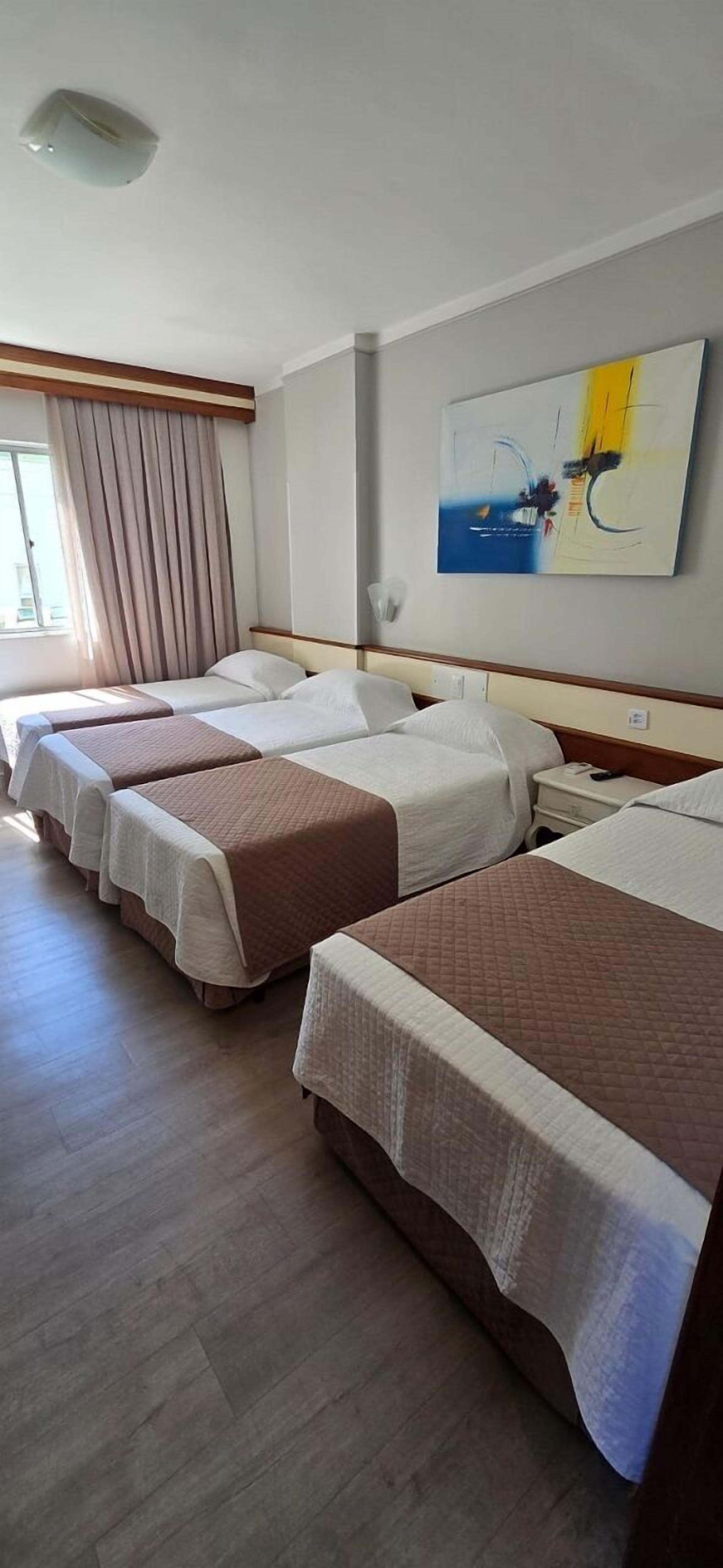 Standard Quadruple Room, Multiple Beds | Minibar, in-room safe, desk, blackout drapes