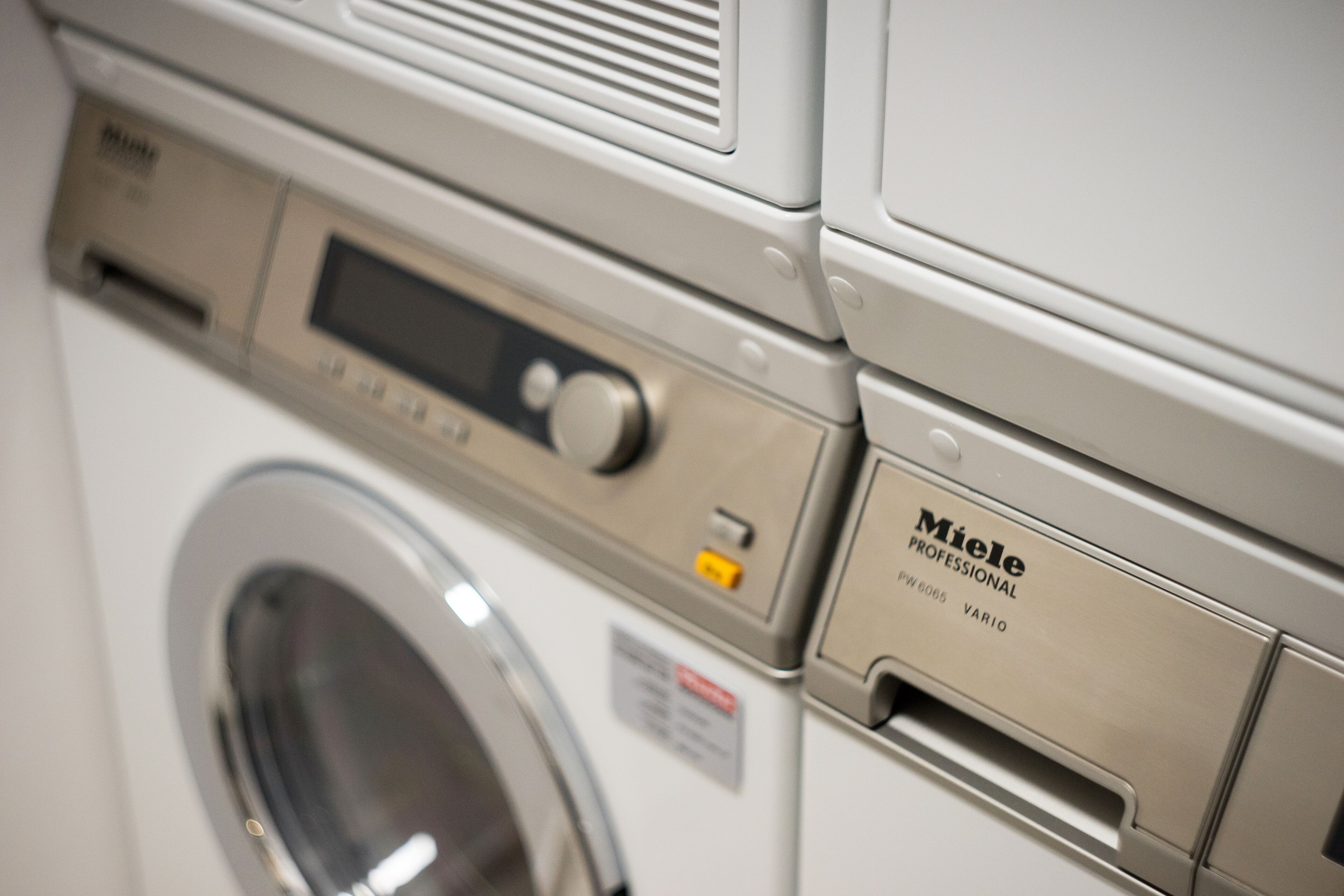 A front view of a Miele Professional washing machine.
