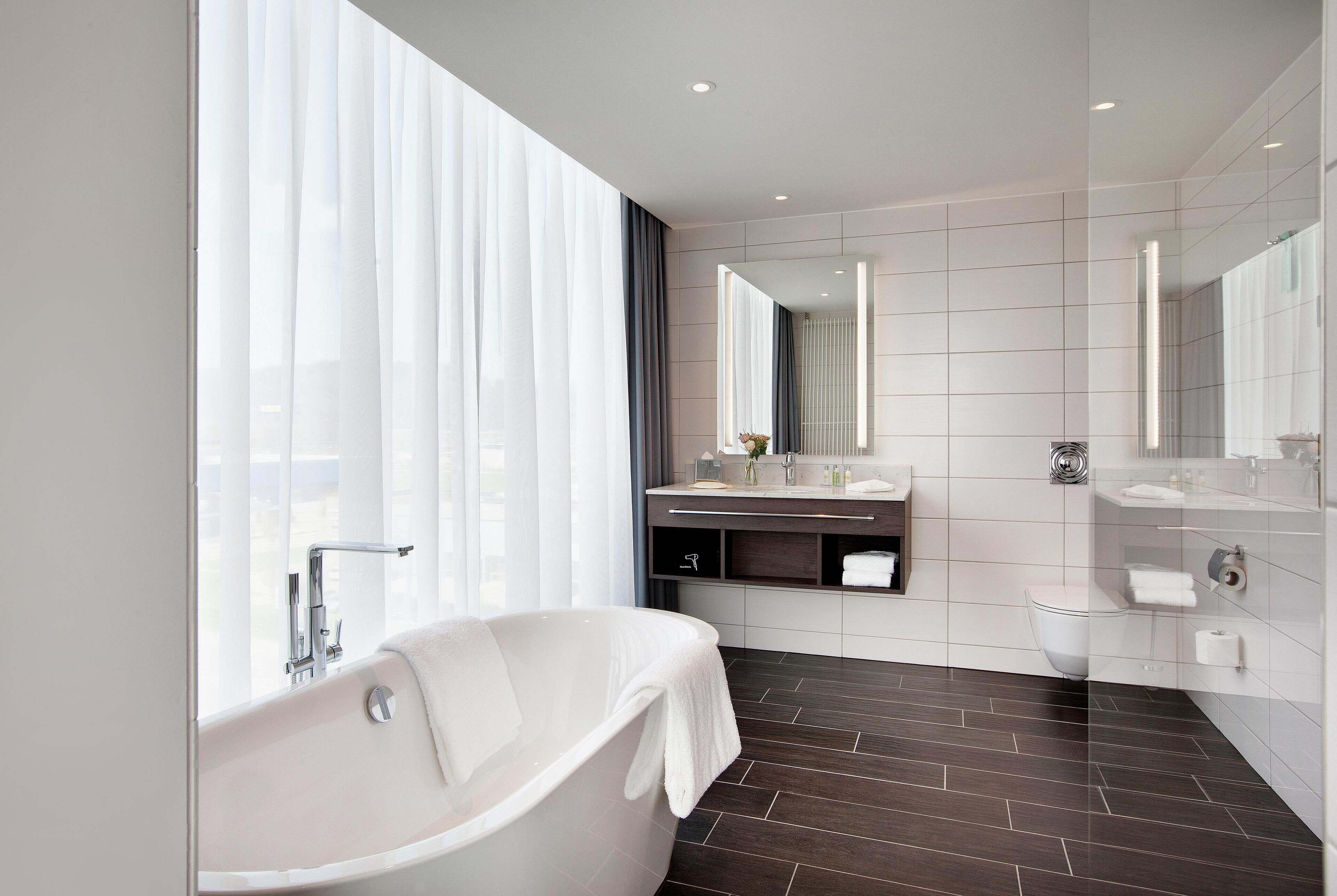 Suite, 1 Bedroom | Bathroom | Shower, free toiletries, hair dryer, bathrobes