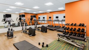 A gym with cardio machines, weight benches, and dumbbells. - Holiday Inn Express and Suites Union Gap- Yakima Area by IHG (Yakima)